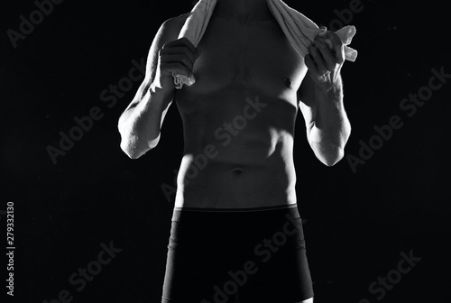 man with a towel on a black background naked torso