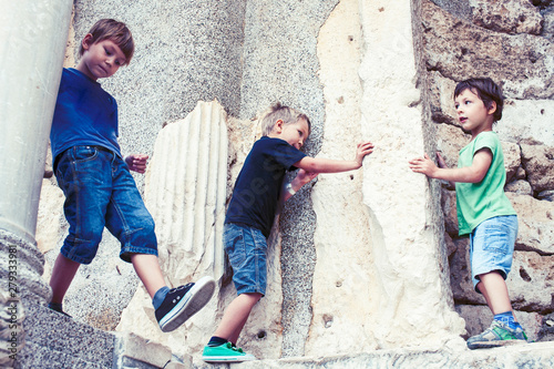 little boy exploring ancient architecture, lifestyle people on summer vacation close up