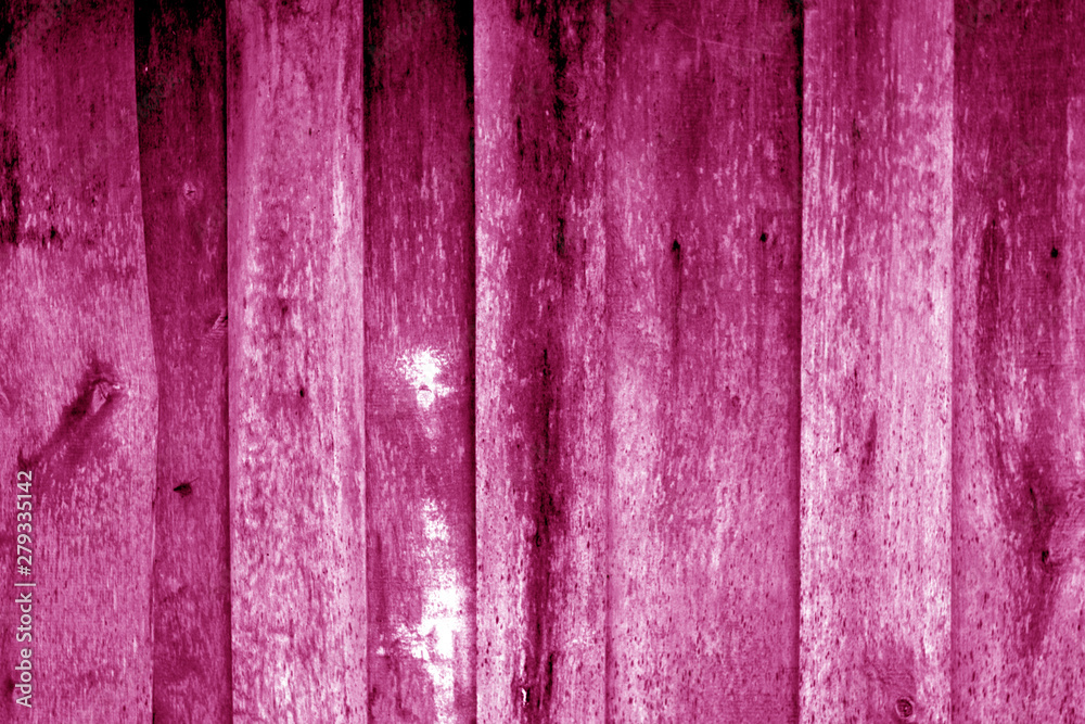 Obraz premium Weathered wooden fence in pink color.