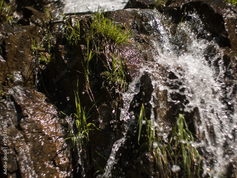 waterfall closeup with spray and rocks waterfall closeup with spray and rocks