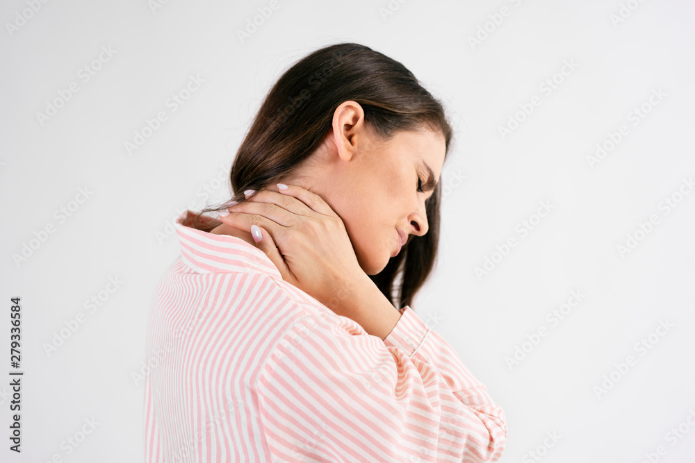 Side view of young woman suffering from neck pain Side view of young woman suffering from neck pain