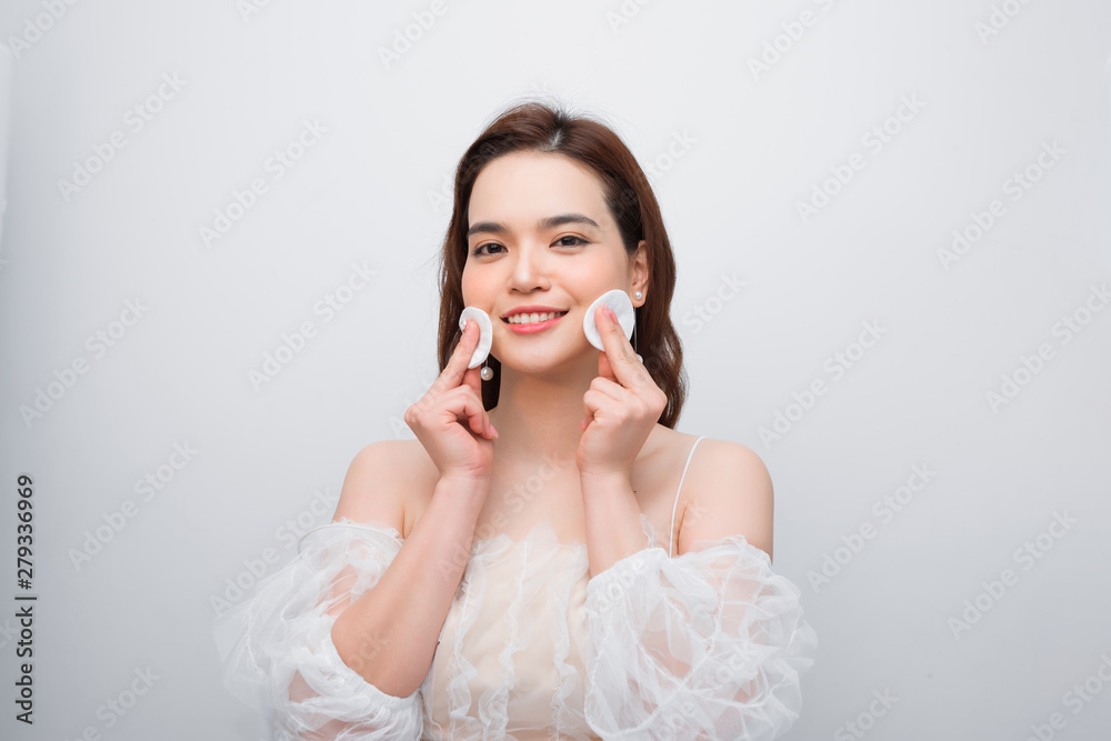 Beautiful young smiling woman with clean cotton pads . Facial treatment. Beauty skin care famale face . Expressive facial expressions. Beautiful young smiling woman with clean cotton pads . Facial treatment. Beauty skin care famale face . Expressive facial expressions.