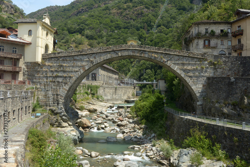 The ancient Roman bridge in the town of Pont St Martin in the Aosta Valley - Italy