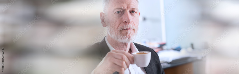 Portrait of smiling senior businessman with a cup of coffee; panoramic banner Portrait of smiling senior businessman with a cup of coffee; panoramic banner