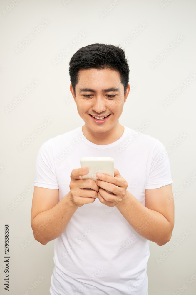 Asian young man use of the cellphone Asian young man use of the cellphone