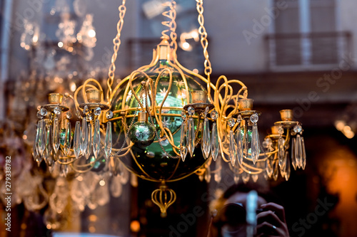 Antique shop in paris. Chandeliers and crystal. The decor and interior in the old style.