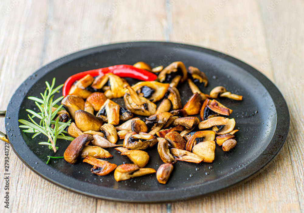 Fried mushrooms with chilli and seasonings. Fried mushrooms with chilli and seasonings.