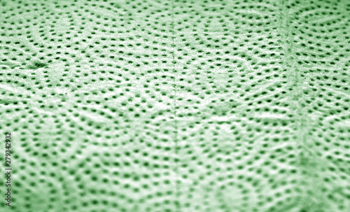 Paper towel surface with blur effect in green color.