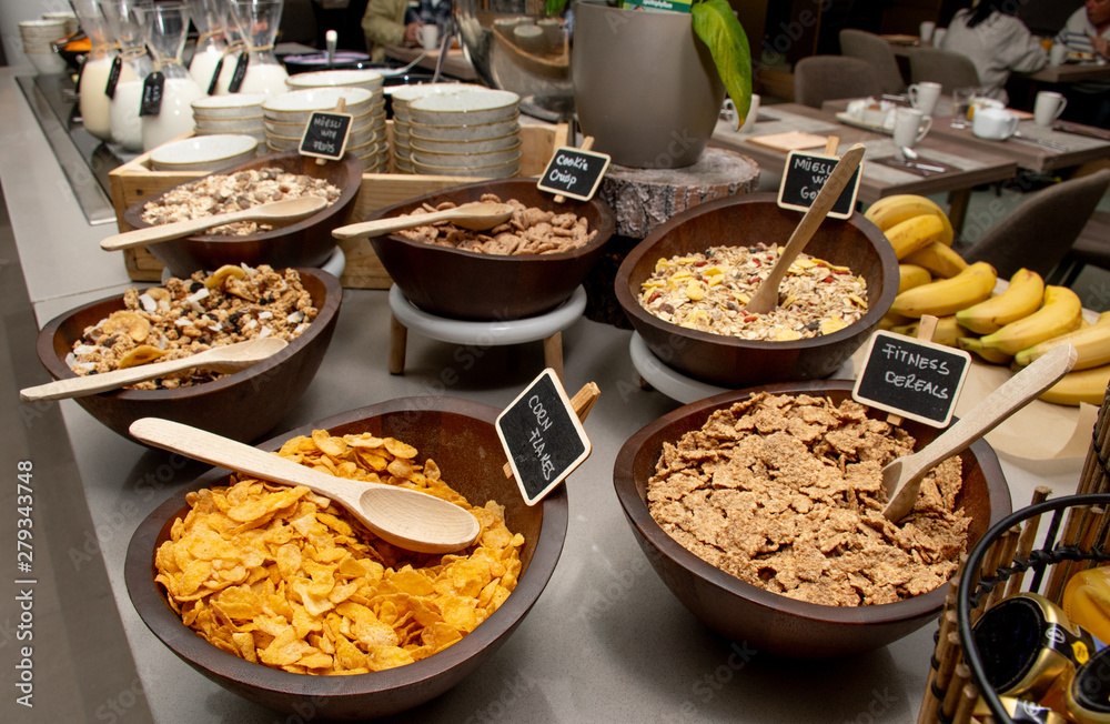 Correspondence Manifestation forgiven Selection of self service catering continental breakfast buffet display,  catering or brunch table food buffet filled with all sorts of delicious  food, cereal display in a hotel or restaurant setting Stock Photo 