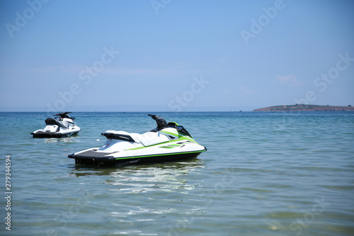 two jet skis in the open ocean. hydrocycles on the sea surface. personal watercrafts are ready to ride