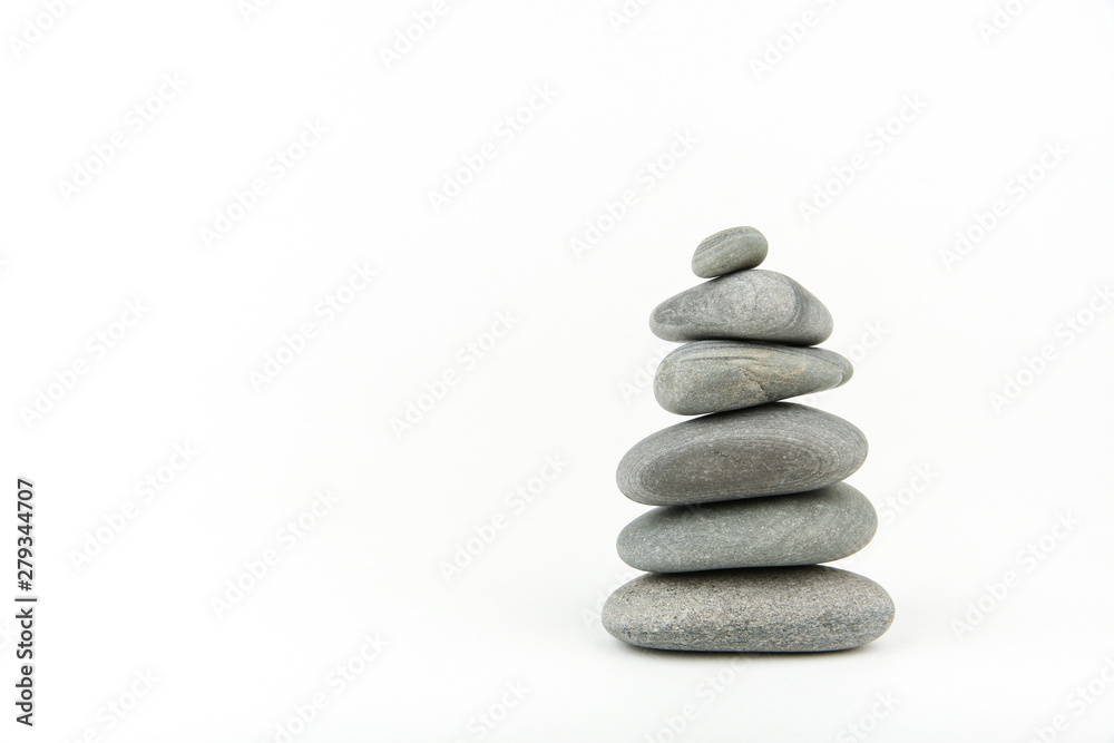 background of sea smooth stones. pyramid of stones on white background with copy space background of sea smooth stones. pyramid of stones on white background with copy space