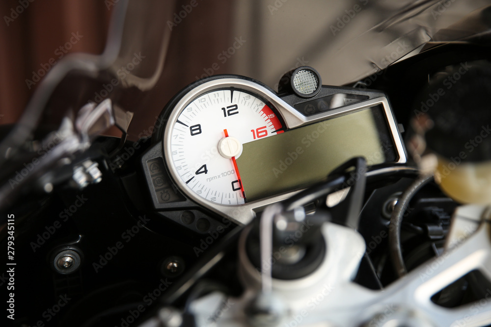 tachometer of a motorcycle close up. dashboard of fast sportbike