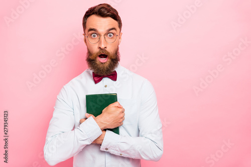 Photography Close up photo of stunned shocked guy hugging book with green cover isolated pas