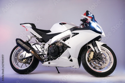 white sportbike  isolated on gray background view from the side. sport modern motorcycle on light grey background