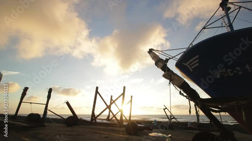 timelapse del atardecer en el muelle del pueblo marinero de  La Santa en la isla de Lanzarote photo