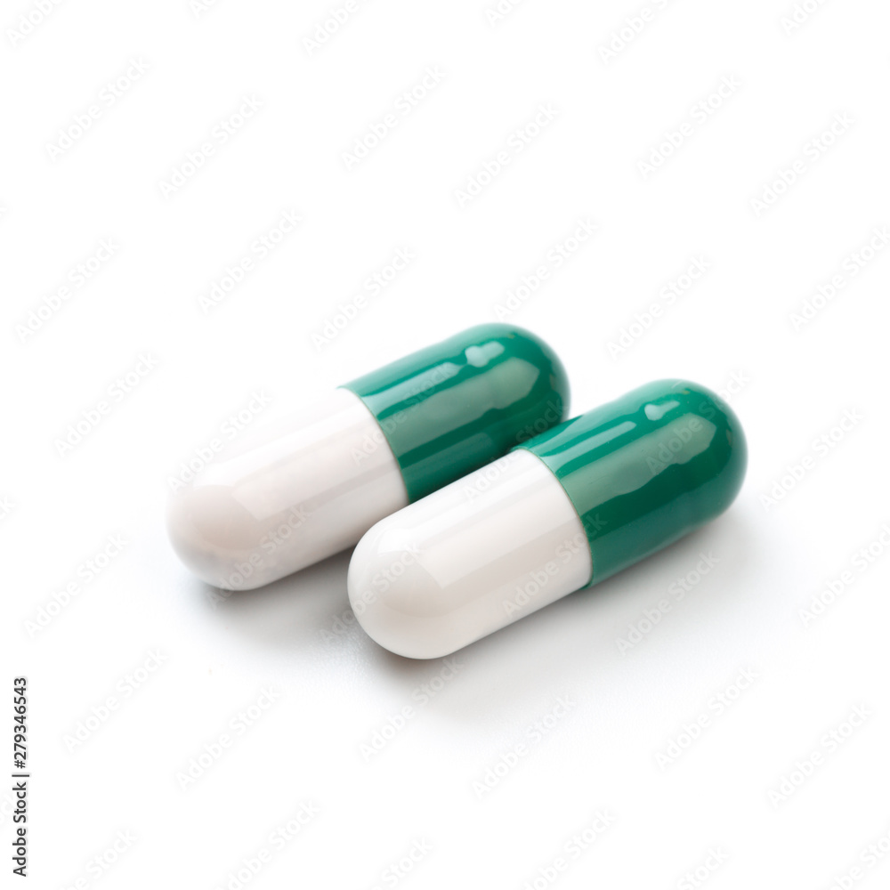 Capsule, pill on white background - isolated. Drug for health care. Biological food additives. Medical background for presentations and advertising of drugs Capsule, pill on white background - isolated. Drug for health care. Biological food additives. Medical background for presentations and advertising of drugs