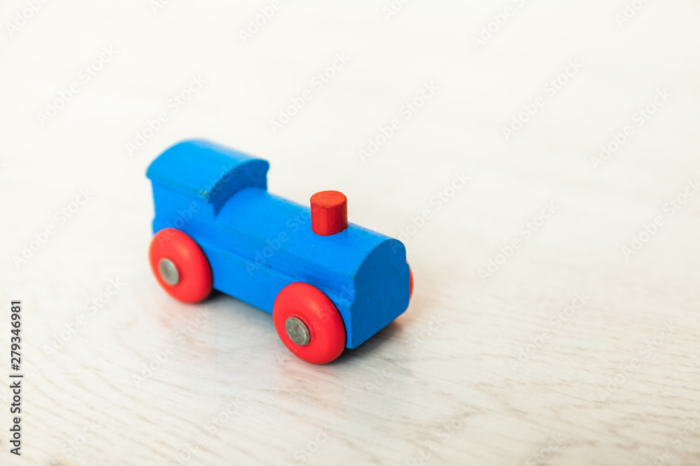 Obraz premium Child'd wooden train on the white floor