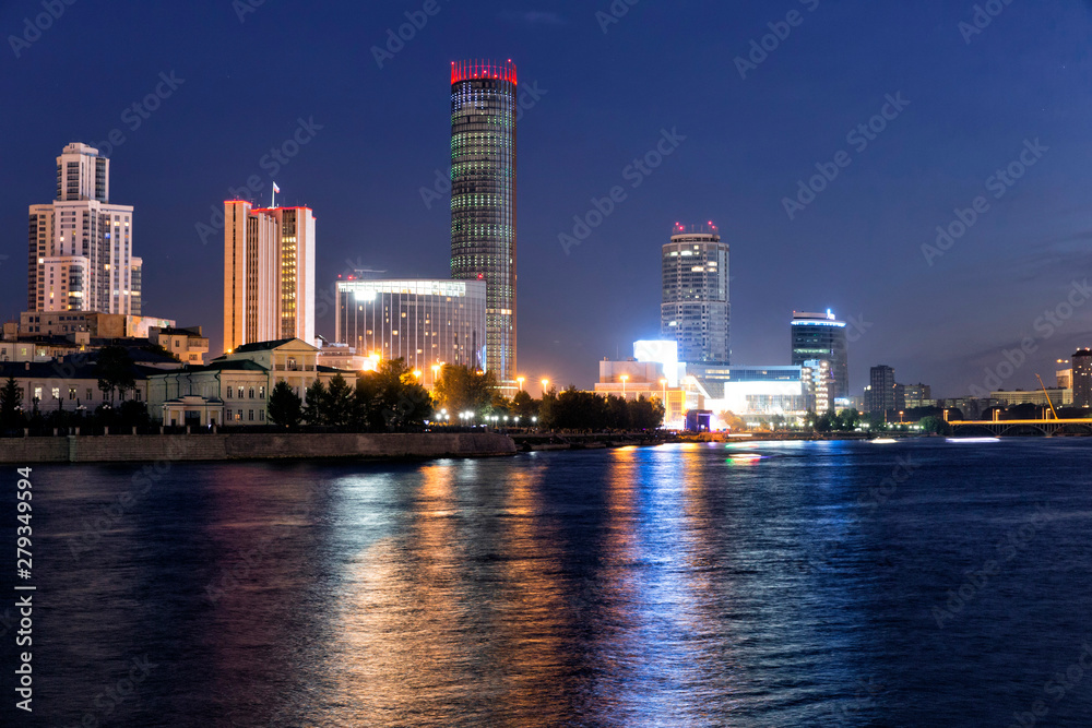 Fototapeta premium Night view of the skyscrapers of the city of Yekaterinburg. Russia. Reflection in the river