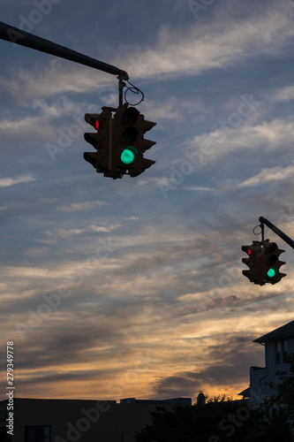 Traffic light with red light against the evening sky in USA.  Selective focus.