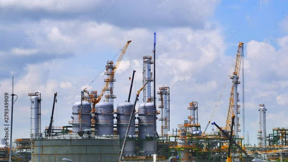 Oil and gas petroleum refinery plant structure on day time , Panning video Oil and gas petroleum refinery plant structure on day time , Panning video