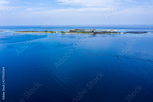 Aerial view, lagoon of Maldives island Olhuveli with water bungalows, South Male Atoll Maldives