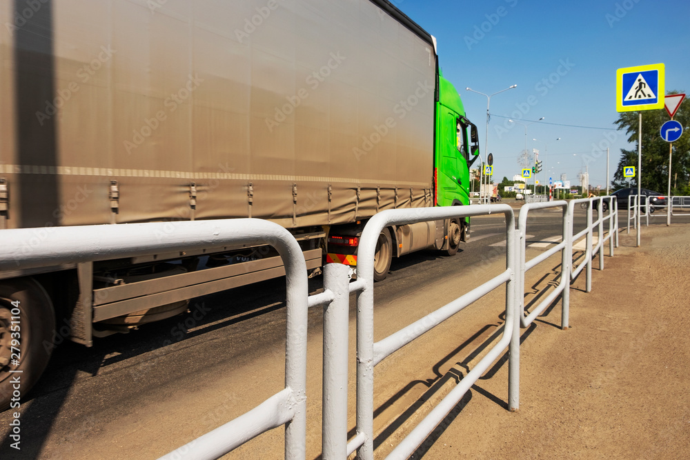 Heavy car stopped in front of a pedestrian crossing Heavy car stopped in front of a pedestrian crossing