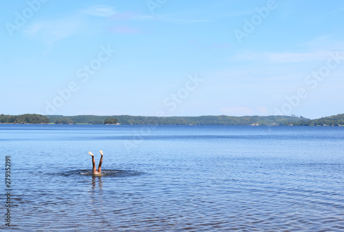 Handstand in lake in Sweden