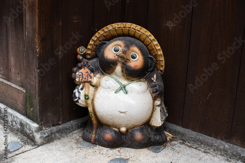 Japanese Tanuki statue in a traditional garden in Kyoto, Japan