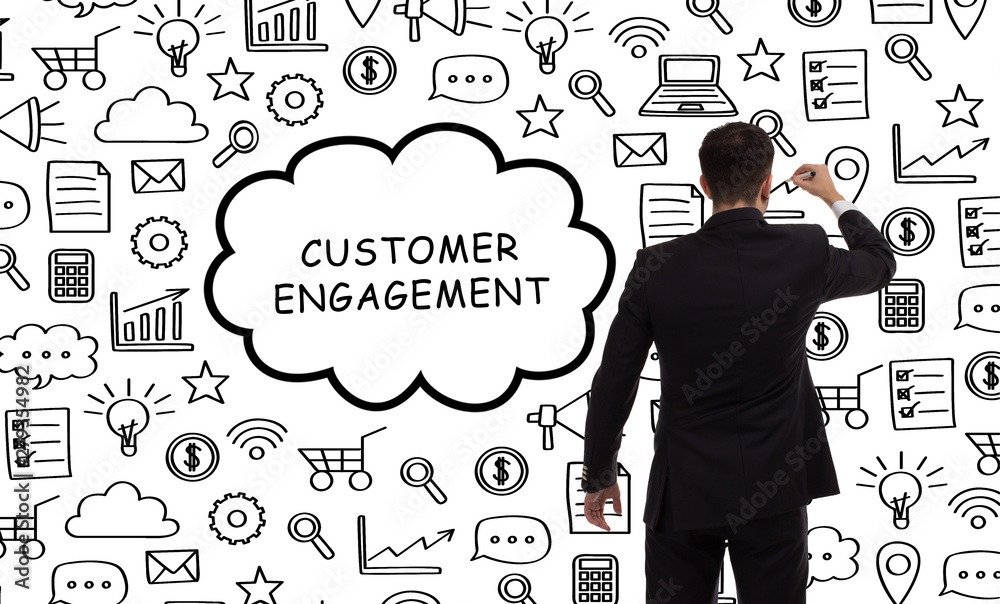Business, technology, internet and networking concept. Young entrepreneur showing keyword: Customer engagement Business, technology, internet and networking concept. Young entrepreneur showing keyword: Customer engagement
