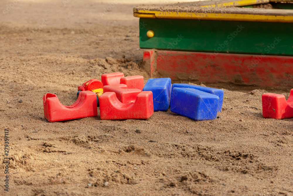 Children's plastic toys in the sandbox for the development of skills and training of the child. Children's plastic toys in the sandbox for the development of skills and training of the child.