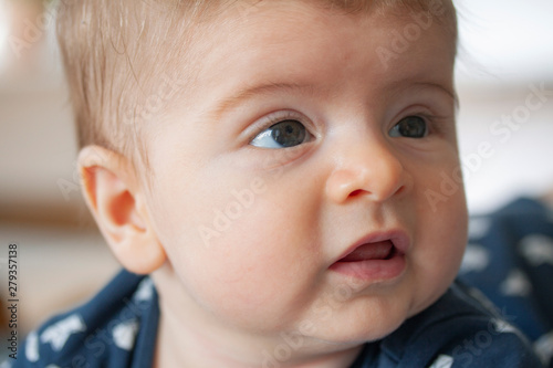 Cute chubby caucasian baby face. Close up image.