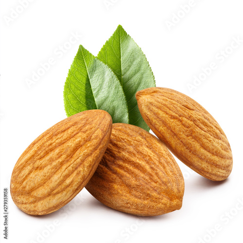 Close-up of three almonds with leaves, isolated on white background