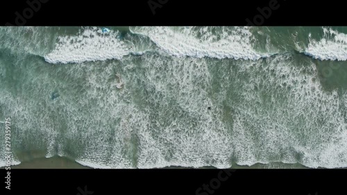 Top-Down Aerial Drone Shot of Kiteboarders and Windsurfers on Waves (Waddell Beach, Pacific Coast Highway, California) photo