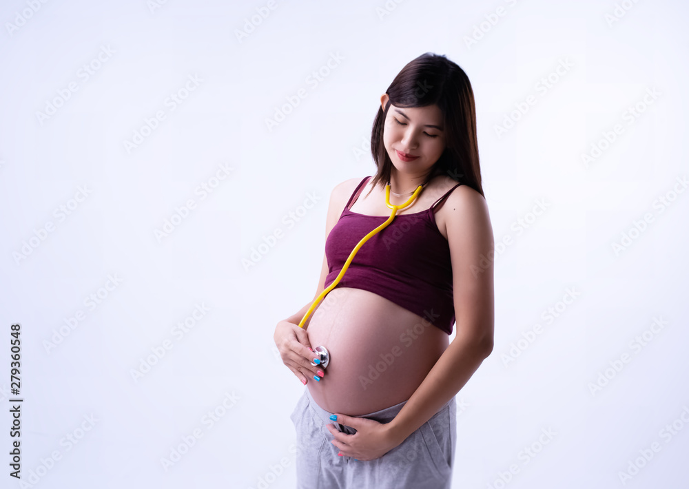 The pregnant woman put stethoscope touch her belly,with love and  care,waiting for newborn,Warm feeling Stock Photo | Adobe Stock