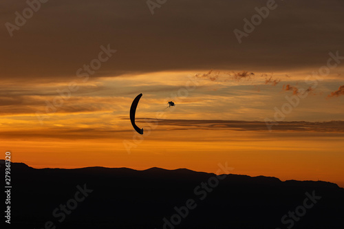 Sunset and paraglider photo