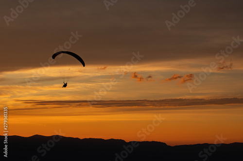 Sunset and paraglider