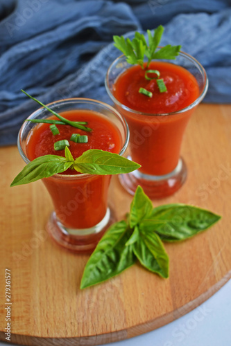 Cold gazpacho soup in a glass. Tomato soup with onion, paprika and parsley.