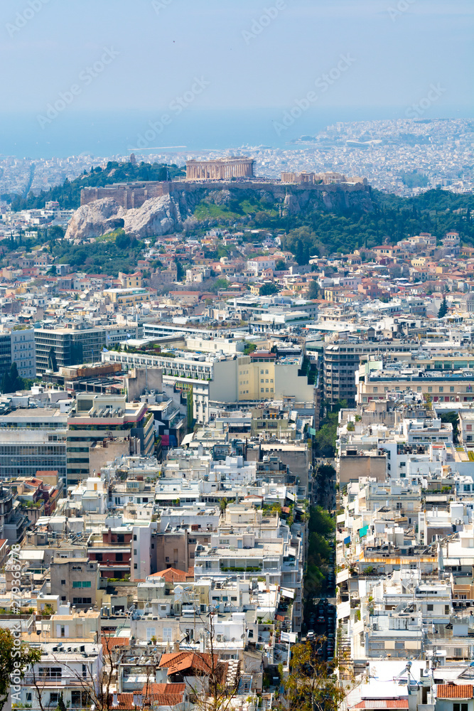 Athens in spring, view from hill,  cityscape with streets and buildings, ancient urbal culture