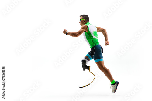 Athlete with disabilities or amputee isolated on white studio background. Professional male runner with leg prosthesis training and practicing in studio. Disabled sport and healthy lifestyle concept. © master1305