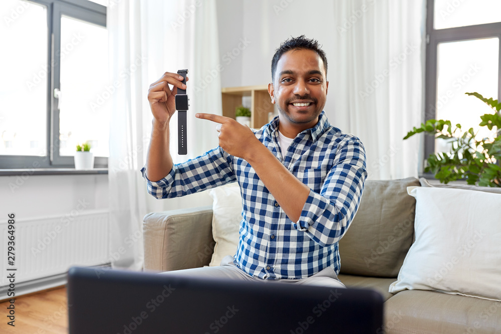 blogging, videoblog and people concept - smiling indian male blogger recording video review of smart watch at home blogging, videoblog and people concept - smiling indian male blogger recording video review of smart watch at home