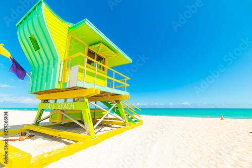 Sun shining over a colorful lifeguard tower in Miami Beach
