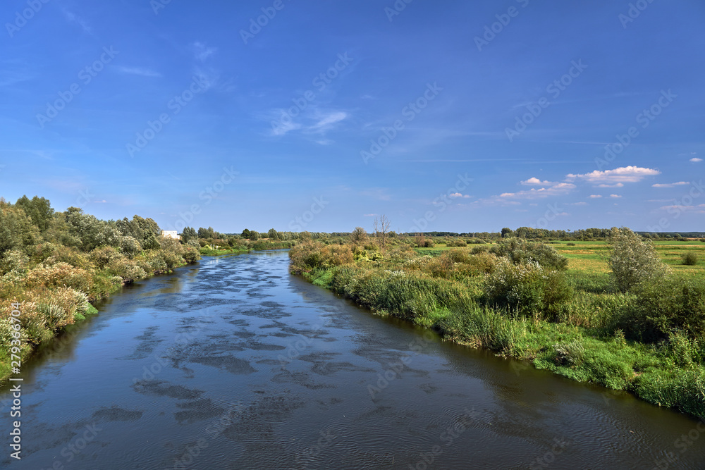 Notec River and rural landscape in summer in Poland.
