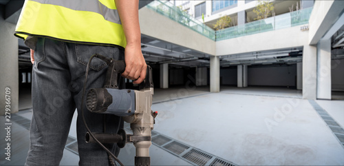 Construction Worker in front of construction site