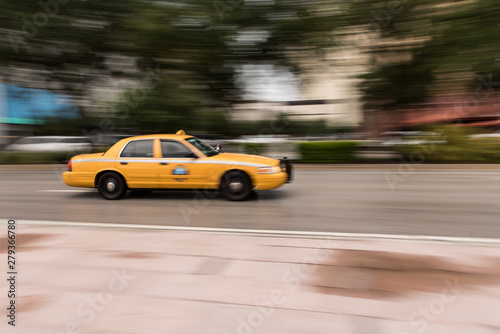 Motion Blur of Taxi Speeding Down a City Street