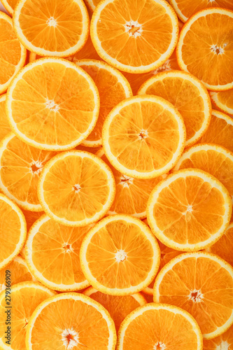Round orange slices, in the form of texture and lanterns of fresh juicy slices