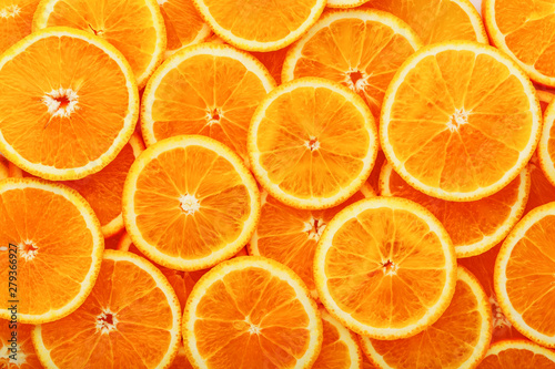 Round orange slices, in the form of texture and lanterns of fresh juicy slices