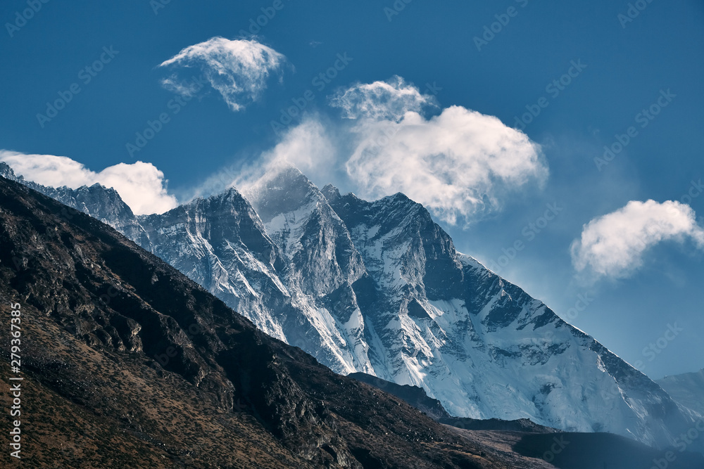 Fototapeta premium Harsh mountain landscape of rocky and snowy Himalayan peaks.
