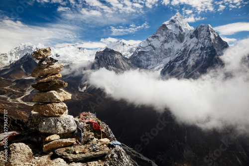 Stacking stone on the trail to Everest Base Camp in Nepal. Buddhist prayer mound.