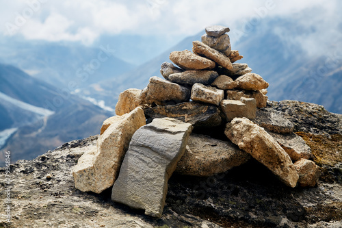 Stacking stone on the trail to Everest Base Camp in Nepal. Buddhist prayer mound.