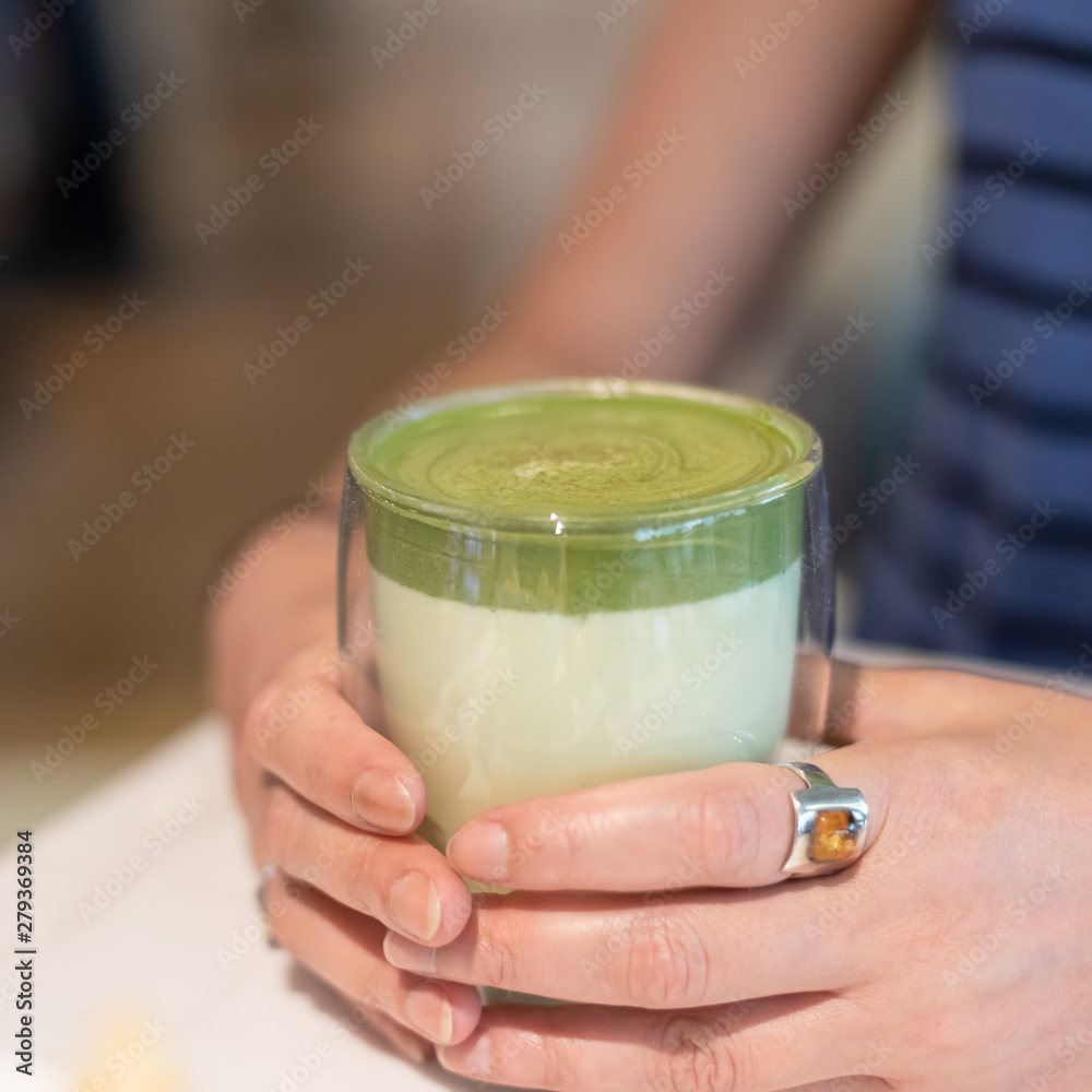 cup of matcha milk tea on table cup of matcha milk tea on table